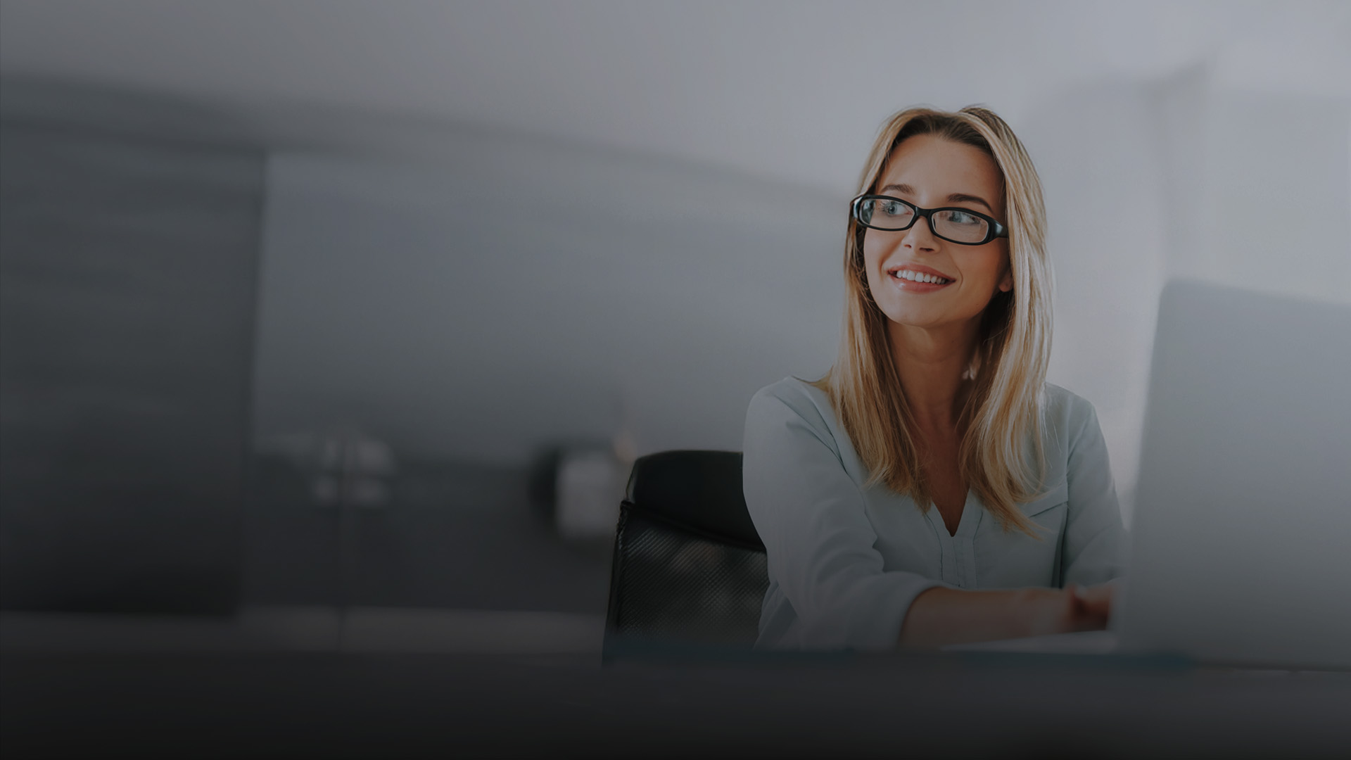 A woman happy about a newly approved loan