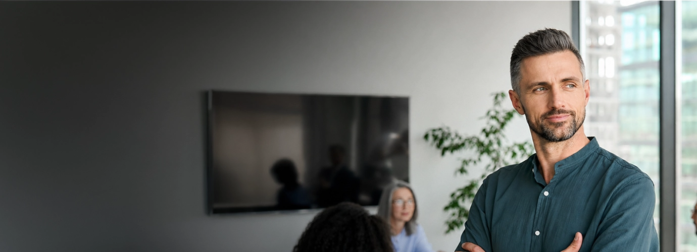 A Hexaware’s cloud consultant standing in a professional services company